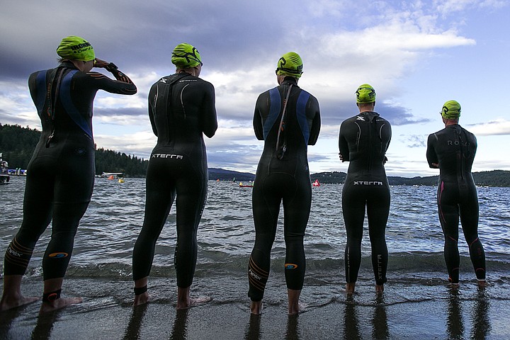 &lt;p&gt;JAKE PARRISH/Press&lt;/p&gt;&lt;p&gt;Women in the professional bracket take in the scene of the Ironman swimming course on Lake Coeur d'Alene before the start of the triathlon on Sunday.&lt;/p&gt;