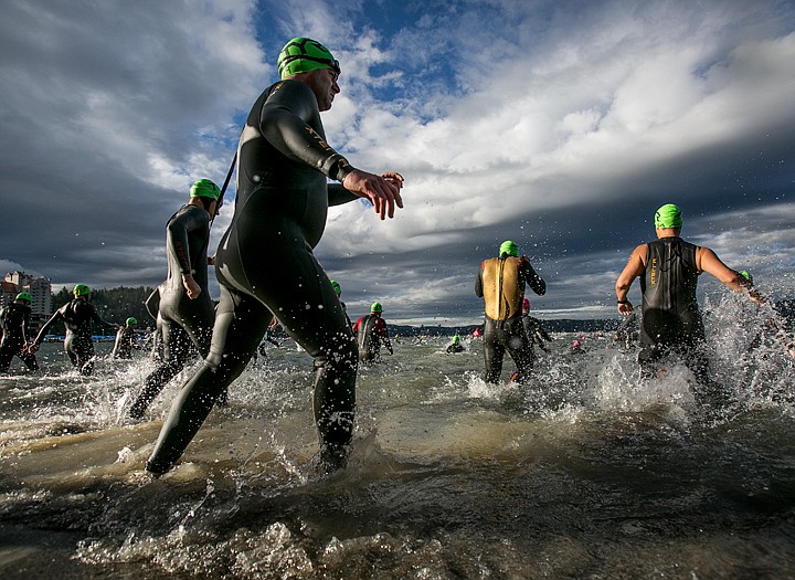 &lt;p&gt;JAKE PARRISH/Press&lt;/p&gt;&lt;p&gt;Gabriel Harley rushes into Lake Coeur d'Alene behind other age-group athletes to begin the 140.6-mile Ironman triathlon.&lt;/p&gt;