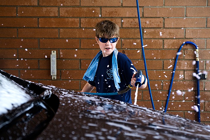 &lt;p&gt;TESS FREEMAN/Press&lt;/p&gt;&lt;p&gt;Ayden Charland, 9, washes a car with the rest of his troop, Cub Scout, pack 3, chartered through Ramsey Elementary&#160;School to benefit a fellow troop member whose mom is fighting lung cancer.&lt;/p&gt;