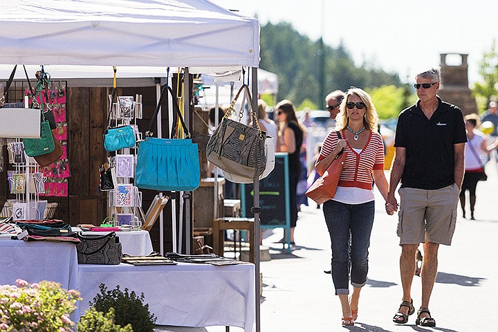 &lt;p&gt;SHAWN GUST/Press&lt;/p&gt;&lt;p&gt;Gina and Scott Mote, of Coeur d&#146;Alene, stroll along N. Main Street Thursday at the Riverstone Street Fair. The event, held weekly throughout the summer, includes dozens of vendor&#146;s booths offering children&#146;s attractions, food, music and artisan craft items.&lt;/p&gt;