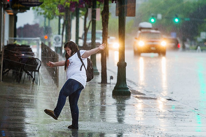 &lt;p&gt;SHAWN GUST/Press&lt;/p&gt;&lt;p&gt;Kayla Wagner, 15, dances in the rain near the intersection of Sherman Avenue and Third Street while waiting for a ride Tuesday in Coeur d&#146;Alene. A storm that moved into the area in the afternoon brought heavy rains and gusty winds.&lt;/p&gt;