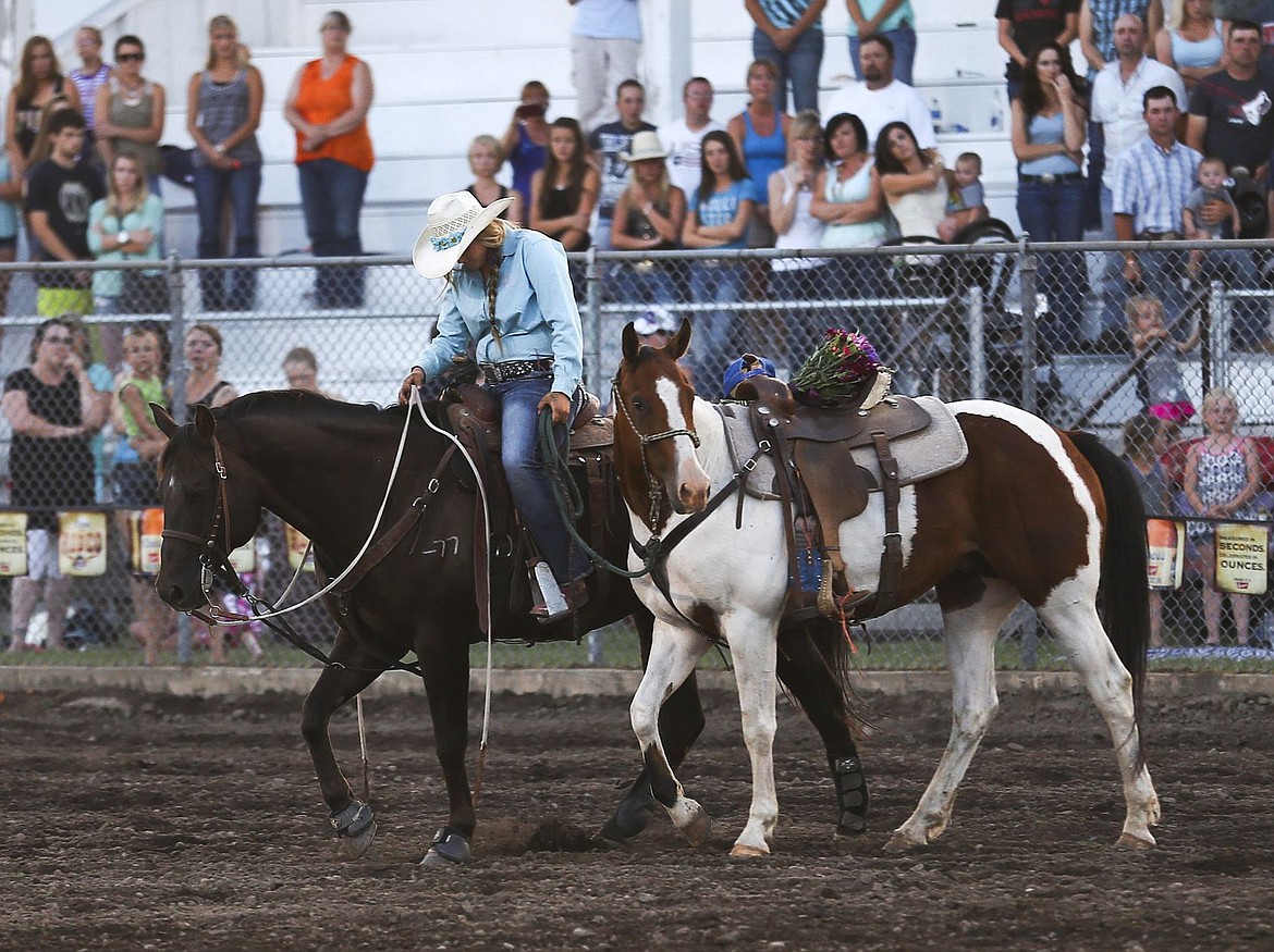 &lt;p&gt;Kylie Richter/ Lake County Leader Callie Otoupalik leads her fallen friend's horse around the Polson rodeo arena.&lt;/p&gt;