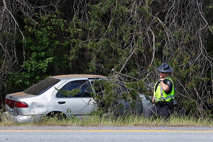 &lt;p&gt;SHAWN GUST/Press&lt;/p&gt;&lt;p&gt;A trooper with Idaho State Police makes a radio call Monday at the scene of an accident east of the Huetter rest stop between milepost 8 and 9 along Interstate-90.&lt;/p&gt;