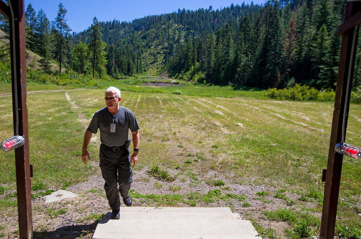 &lt;p&gt;Bob Smith, director of Fernan Rod and Gun Club, walks on a 400-yard rifle range on Tuesday as he demonstrates the safety features of the shooting bay at the club's Fernan location.&lt;/p&gt;