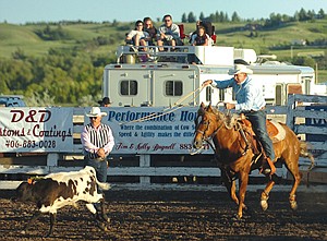 Tim Bagnell, of Ronan, runs down a calf in the tie down roping event of the Mission Mountain PRCA Rodeo last weekend in Polson.