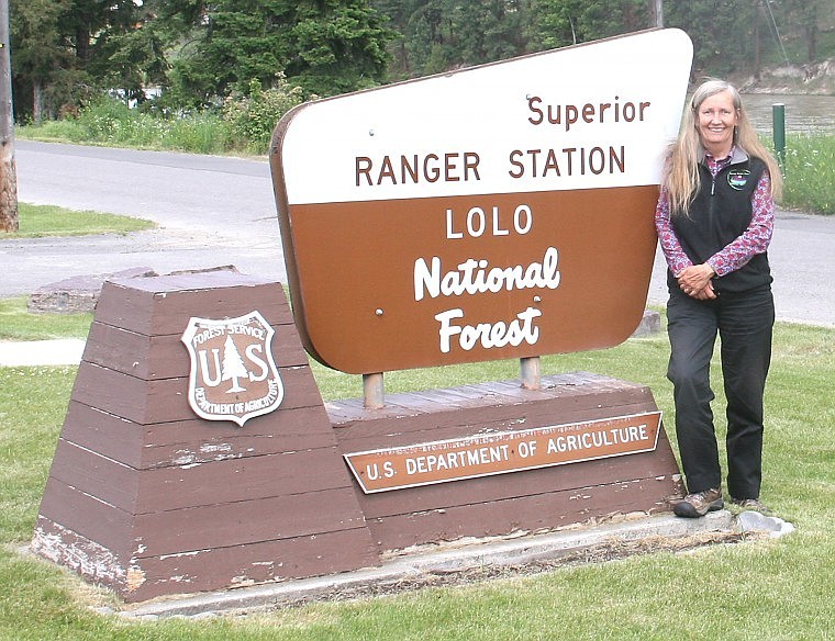 &lt;p&gt;Retired District Ranger Sharon Sweeny stands by the sign outside
the ranger station where she worked for the past five years.&lt;/p&gt;