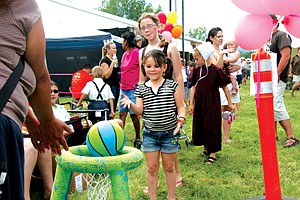Five-year-old Maysa Couture, of Charlo, makes a shot and wins a priza at the 16th Annual St. Ignatius Volunteer Fire Department Firemen&#146;s Picnic held last weekend. All proceeds from the event, totalling about $26,000, went to the cause.