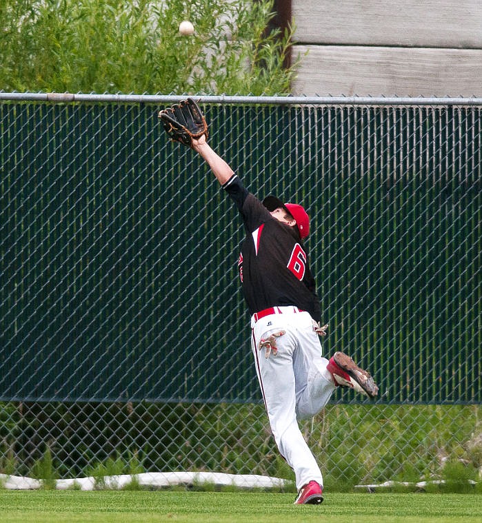 &lt;p&gt;Kalispell center fielder Jake Barstow makes a grab near the fence to get the first out during the second game Friday evening of an American Legion AA baseball doubleheader against the Billings Scarlets at Griffin Field.&#160;&lt;/p&gt;