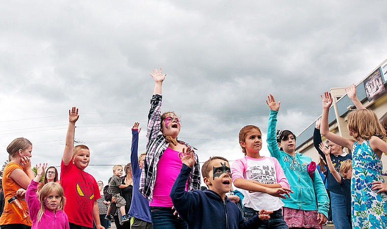 &lt;p&gt;Children raise their hands in hopes of getting free goodies during a prize giveaway Friday afternoon during the street festival to celebrate Flathead Industries 40th anniversary. June 27, 2014 in Kalispell, Montana. (Patrick Cote/Daily Inter Lake)&lt;/p&gt;