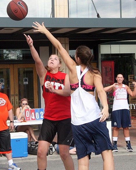 <p>Former Coeur d'Alene Charter Academy standout Paige Kelly drives to the basket for Rack City in an opening round game in the 23rd annual Spokane Hoopfest basketball tournament.</p>