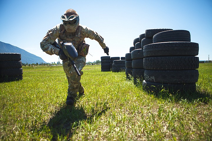 <p>Owner Sean Miller runs for cover during a paintball game Thursday afternoon at Montana Action Parks outside of Columbia Falls. Thursday, June 28, 2012 in Columbia Falls, Montana.</p>
