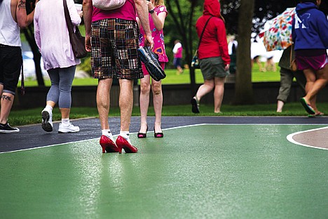 &lt;p&gt;Karl Eastlund traded out his tennis shoes for a pair of ruby red heels Saturday as men - and women - from throughout the community gathered to &quot;Walk a Mile in Her Shoes&quot; as a fundraising event against violence toward women.&lt;/p&gt;