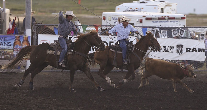 &lt;p&gt;Kylie Richter/ Lake County Leader Jess Brander and Riley Bailey of St. Ignatius compete in team roping Friday night at the Mission Mountain rodeo.&lt;/p&gt;