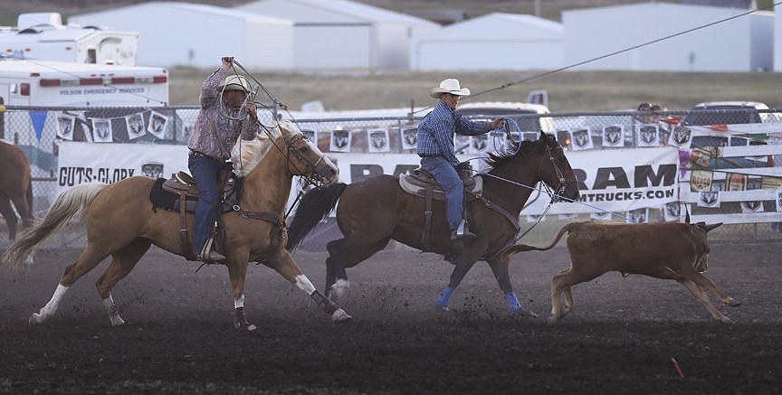 &lt;p&gt;Kylie Richter/ Lake County Leader Will Powell and Josh Harris compete in team roping Friday night at the Mission Mountain rodeo.&lt;/p&gt;