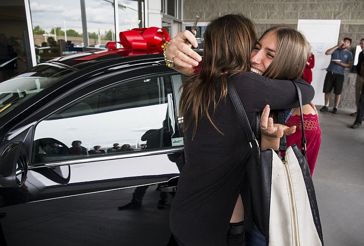 &lt;p&gt;LOREN BENOIT/Press Sarah Sitar, a recent graduate of Lakeland High School, looks at her new set of keys to a 2016 Chevy Sonic LT Turbo as she hugs her mom, Jossene Sitar, Wednesday, June 15, 2016 at Knudtsen Chevrolet. Those picked for the drawing had to attend their high school all-night party to be eligible.&lt;/p&gt;