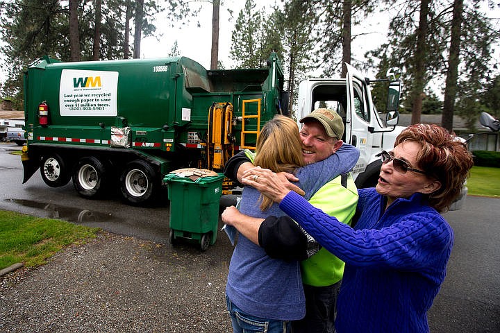 &lt;p&gt;JAKE PARRISH/Press Waste Management garbage truck driver Micah Young recieves a hug on Friday from Judy Vaxter, left, and Patty Humpherys, people he has been picking up garbage for more than two years, as Young makes one of his last route stops on Anne Street in Coeur d'Alene. &quot;He's going to be missed,&quot; Vaxter says. &quot;He's one of the best.&quot;&lt;/p&gt;