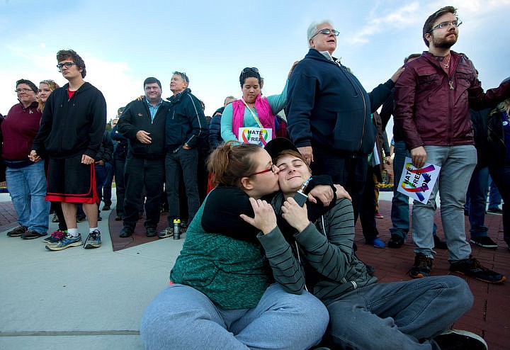 &lt;p&gt;JAKE PARRISH/Press Katy Parsons kisses her partner Tayler Damron at the end of a vigil Thursday evening held to bring the LGBT community together and honor the victims of the Orlando shooting that claimed the lives of 49 people last Sunday. More than 150 attended the vigil, held under the Rainbow Bridge at McEuen Park.&lt;/p&gt;