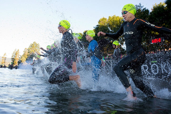 &lt;p&gt;JAKE PARRISH/Press Women in the professional bracket charge into Lake Coeur d'Alene to begin the 70.3-mile Ironman triathalon on Sunday.&lt;/p&gt;