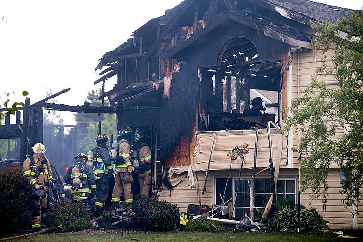 &lt;p&gt;JAKE PARRISH/Press Firefighters from Northern Lakes, Kootenai County Fire and Rescue and Coeur d'Alene fire departments make their way into the charred remains of a two-story home on Tuesday on Sparrow Loop in Post Falls. The homeowner and his daughter were in the home when it caught flame. Fire crews arrived at the scene two minutes after they recieved the first call.&lt;/p&gt;