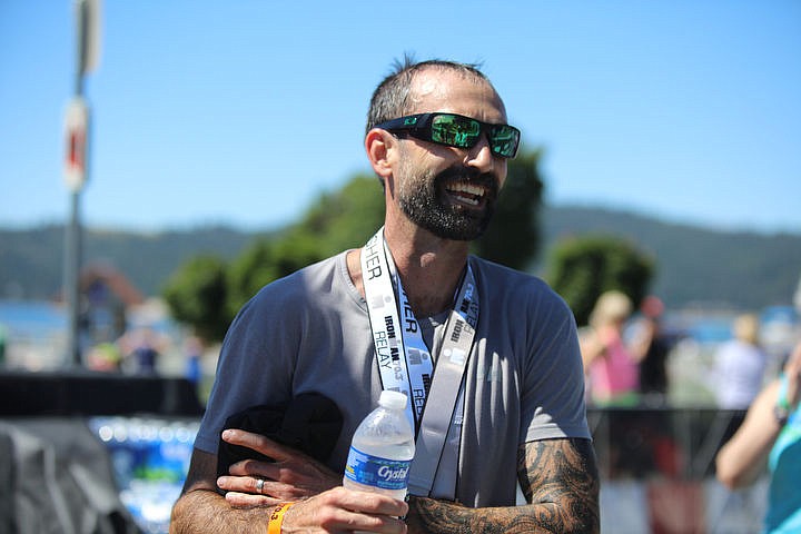 &lt;p&gt;KATIE HARTWIG/Press Andy Cleveland, 38 of Coeur d'Alene is all smiles as he finishes his first Ironman triathlon, Sunday.&lt;/p&gt;