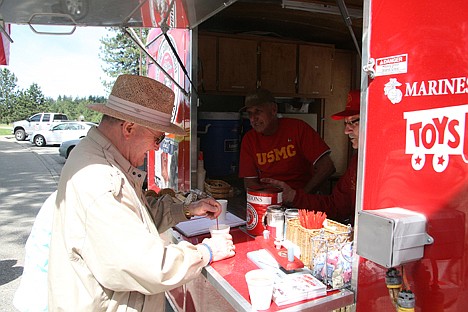 &lt;p&gt;Jim Rice of Rochester, N.Y., fixes coffee and chats with Marine Corps League Pappy Boyington Detachment members Rich Burbine, left, and Roy Higgs. The detachment's Coffee Wagon was parked at the Huetter rest stop on Friday, where it will remain until July 14.&lt;/p&gt;