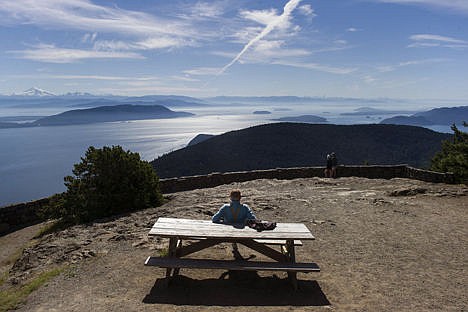 &lt;p&gt;A visitor sits on top of Mount Constitution in Washington, part of Moran State Park and the highest point of the San Juan Islands, July 1, 2014.&lt;/p&gt;