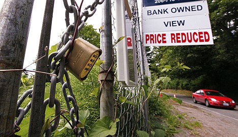 &lt;p&gt;In this June 9 photo, a &quot;bank-owned view price reduced,&quot; lot is chained and locked but advertised for sale, in Seattle. Two years after economists say the Great Recession ended, the recovery has been the weakest and most lopsided of any since the 1930s.&lt;/p&gt;