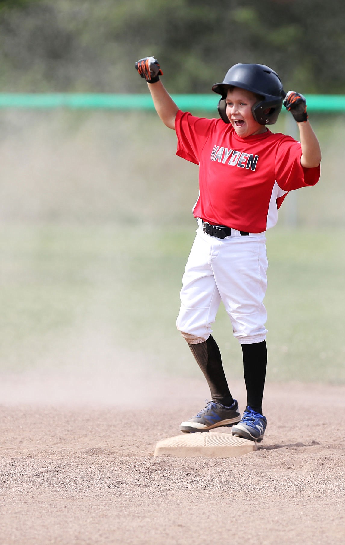 &lt;p&gt;Colin Cherny celebrates hitting a double during an Idaho District 1 age 10-11 tournament game against Post Falls on Friday in Rathdrum.&lt;/p&gt;