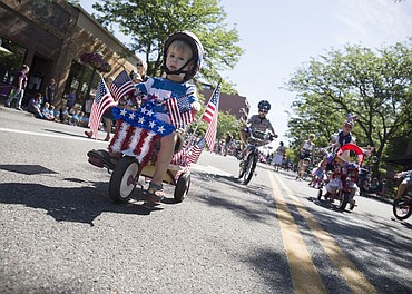 <p>LOREN BENOIT/Hundreds of kids and families kick off the holiday weekend by walking down Sherman Avenue as they participate in Coeur d'Alene's Kids Parade on Friday, July 1, 2016. This years parade theme was Wide World of Sports. To purchase photos, please visit www.cdapress.com</p>