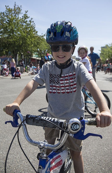 <p>LOREN BENOIT/Hundreds of kids and families kick off the holiday weekend by walking down Sherman Avenue as they participate in Coeur d'Alene's Kids Parade on Friday, July 1, 2016. This years parade theme was Wide World of Sports. To purchase photos, please visit www.cdapress.com</p>