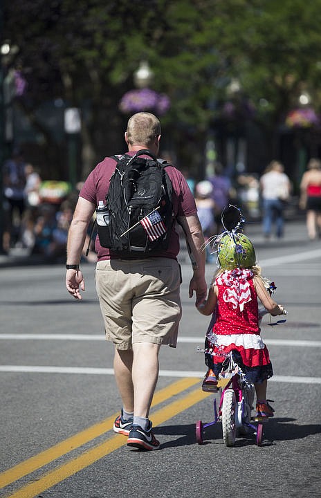 <p>LOREN BENOIT/Hundreds of kids and families kick off the holiday weekend by walking down Sherman Avenue as they participate in Coeur d'Alene's Kids Parade on Friday, July 1, 2016. This years parade theme was Wide World of Sports. To purchase photos, please visit www.cdapress.com</p>