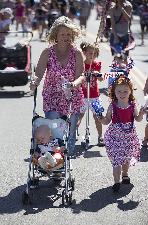 <p>LOREN BENOIT/Hundreds of kids and families kick off the holiday weekend by walking down Sherman Avenue as they participate in Coeur d'Alene's Kids Parade on Friday, July 1, 2016. This years parade theme was Wide World of Sports. To purchase photos, please visit www.cdapress.com</p>