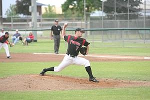 Derrick Pacheco/Columbia Basin Herald&lt;br&gt; Moses Lake starting pitcher John Robinson (7) throws a pitch during the Pirates' season opener June 5 against the visiting Wenatchee AppleSox at Larson Playfield in Moses Lake.