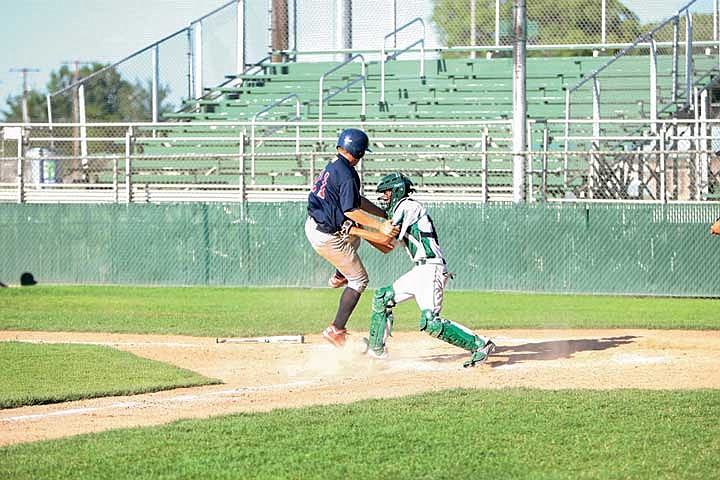 Catcher Erick Huberdeau puts the tag on a Richland runner trying to score.