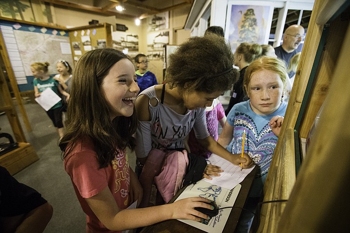 &lt;p&gt;SHAWN GUST/Press Bryan Elementary School fourth graders Kylie Melsha, far left, Sarah Pleasant, and Kristen Roth, right, gather around an information kiosk Friday during a field trip to the Museum of North Idaho in Coeur d'Alene. Donations from Doug and Deidre Chadderdon, Empire Airlines, Viking Construction and Specialty Tree Services helped to provide transportation and cover museum admission for area students learning about Idaho history.&lt;/p&gt;