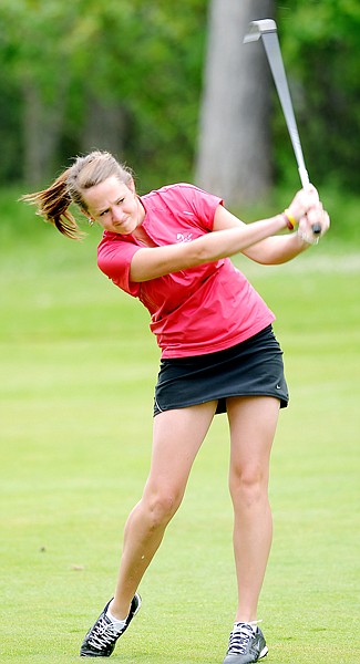 Chelsea Ray of Whitefish attempts to get onto the green of the 9th hole on the South Course at the 74th annual Whitefish Lake Fourth of July Tournament on Thursday.