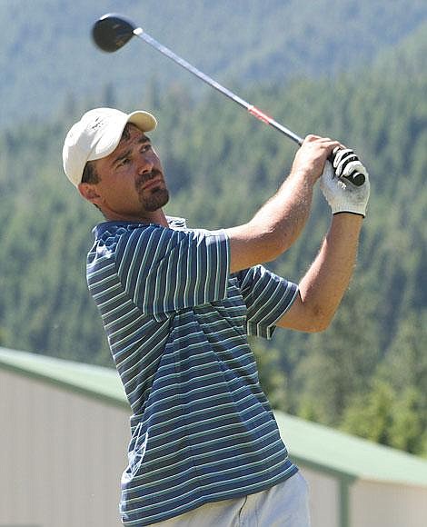 Photo by Nick Ianniello Mike Park takes a chip shot on on the first hole of the Trestle Creek Golf Course during the Chamber of Commerce Golf Tournament Saturday. The foursome scored a birdy on the hole.