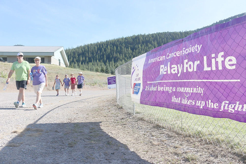 <p>Relay For Life participants walk the track at Superior High School last week to celebrate those who have survived cancer and remember those lost to the debilitating disease.</p>