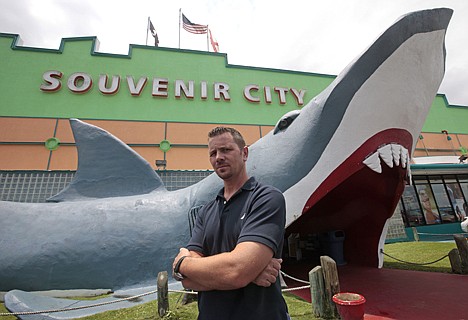 &lt;p&gt;Souvenir City owner Paul Johnson stands outside his store in Gulf Shores, Ala., on Friday. Johnson says business is down by about half because of the oil spill but he is hoping for improvement over the Fourth of July weekend. However, more oil from the Deepwater Horizon incident is expected to come ashore over the weekend.&lt;/p&gt;