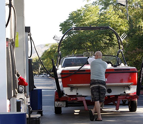 &lt;p&gt;A motorist buys gas for his boat, getting an early start on the holiday weekend traffic Friday in Burbank, Calif. The national average now stands at $3.55 per gallon.&lt;/p&gt;