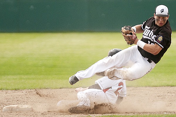 &lt;p&gt;Glacier Twins second baseman Cody Elek is up ended as he tries
to turn a double play against the Calagary Redbirds Thursday
afternoon at Memorial Park.&lt;/p&gt;