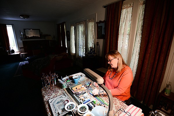 &lt;p&gt;Carolyn Snyder demonstrates how she makes her beads on Thursday, June 20, at her home in Kalispell. (Brenda Ahearn/Daily Inter Lake)&lt;/p&gt;