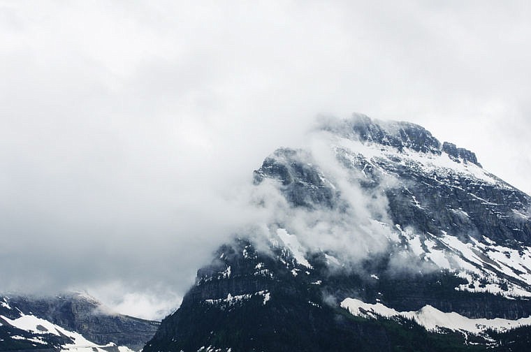 <p>Cloudy peaks seen Friday afternoon from Going-to-the-Sun Road in Glacier National Park. June 21, 2013 in Glacier National Park, Montana. (Patrick Cote/Daily Inter Lake)</p>