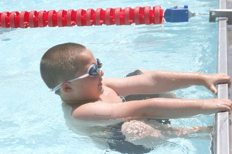 &lt;p&gt;Cole Dubois prepares to swim the backstroke during a meet earlier in the season. The start involves a reverse, blind takeoff from the starting block.&lt;/p&gt;