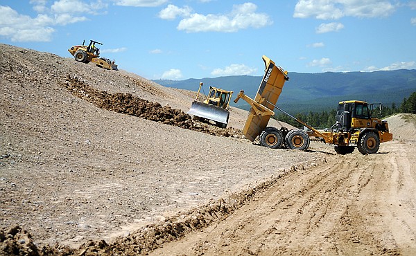 A layer of native soil is applied to the North Closer Slope on Monday at the Flathead County Landfill. Once the native soil layer is complete work will begin on adding a layer of low permeability soil to bring the area up to Department of Environmental Quality standards for final closure.