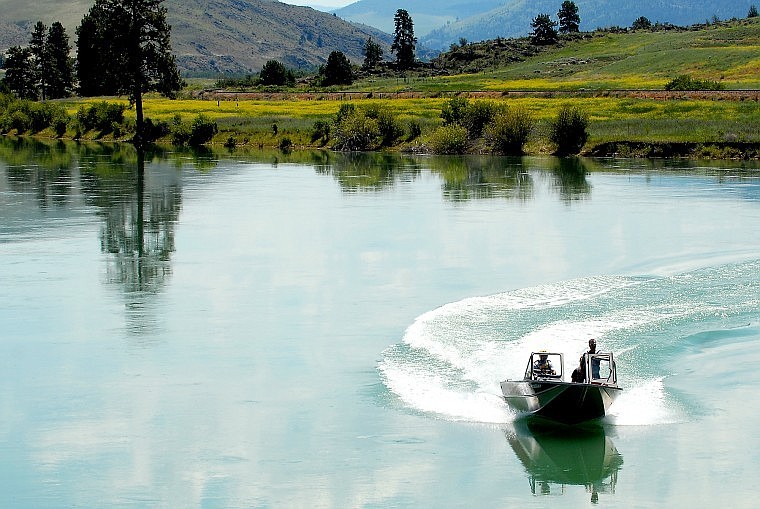 A Mineral County Search and Rescue crew maneuvers on the lower Flathead River on Tuesday afternoon. At least four boats fitted with sonar equipment searched the river between the town of Dixon and the river&#146;s confluence with the Clark Fork River, searching for a missing small plane.