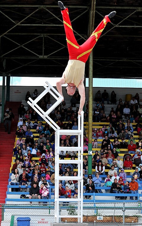 &#147;The Amazing Asante&#148; balances himself on a towering stack of chairs in front of the crowd at the Flathead County Fairgrounds on Friday afternoon during the Shrine Circus.