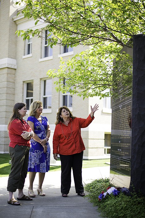 &lt;p&gt;Kerri Thoreson, right, talks with Heather Callahan, president of the Fraternal Order of Eagles, Coeur d'Alene Auxiliary #486, far left, and Barbara Smalley, vice president of the organization, about the names on the existing Killed in Action monument Tuesday at the Ronald D. Rankin Veterans Memorial Plaza between the Kootenai County Courthouse and the county administration building in Coeur d'Alene. The Eagles made a donation of $500 to be used towards a new monument dedicated to local soldiers killed in action in Iraq.&lt;/p&gt;