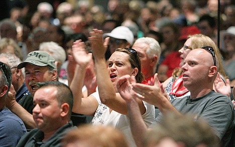 &lt;p&gt;Attendees cheer as Riverside County Supervisor Jeff Stone speaks during a Wednesday meeting in Murrieta, Calif., about a plan to process immigrants detained in Texas at the Murrieta U.S. Border Patrol facility.&lt;/p&gt;