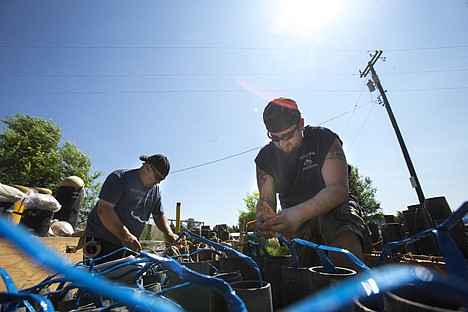 &lt;p&gt;Ryan Austin, right, and Josh Vaughan with Entertainment Fireworks set up the fireworks display Wednesday. The display will feature some shells up to 12 inches in diameter, costing upward of $3,000 per shell.&lt;/p&gt;